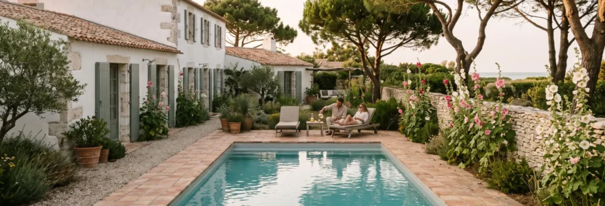 Guests relax beside the private pool of a whitewashed luxury villa on Île de Ré.